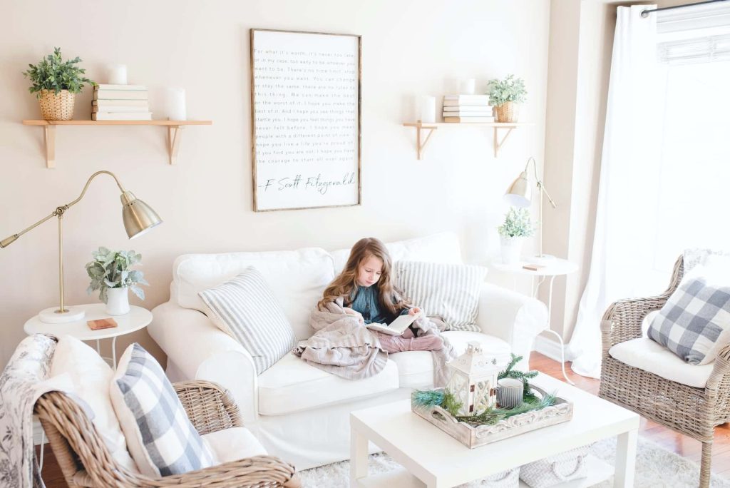 girl reading in the living room